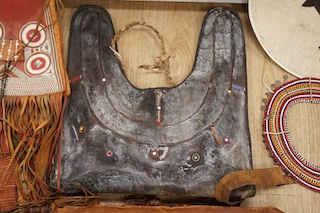 A collection of tribal leather bags and African beadwork items to include water flask and necklaces. Condition - mostly fair